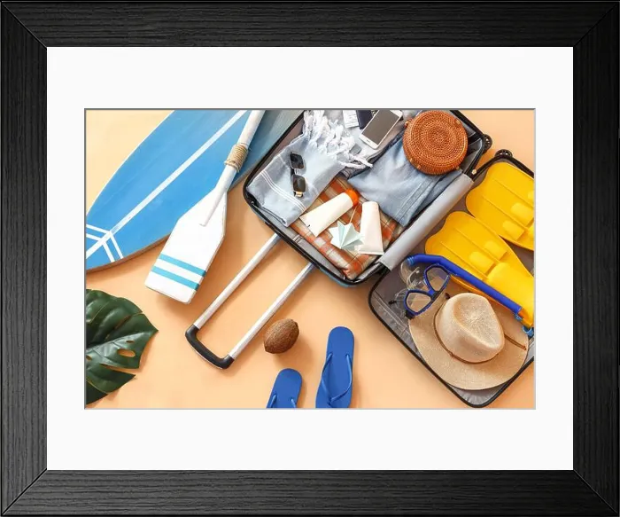 Framed Print : Suitcase with clothes, beach accessories and surfboard on beige background. Travel concept Framed Print : Suitcase with clothes, beach accessories and surfboard on beige background. Travel concept