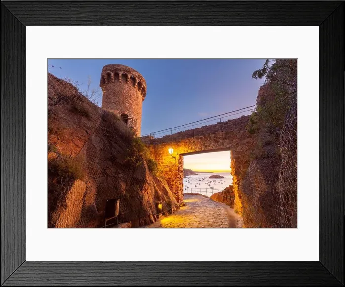 Framed Print : View of a tower and stone gateway of Tossa de Mar Castle overlooking the Mediterranean Sea at sunrise Framed Print : View of a tower and stone gateway of Tossa de Mar Castle overlooking the Mediterranean Sea at sunrise