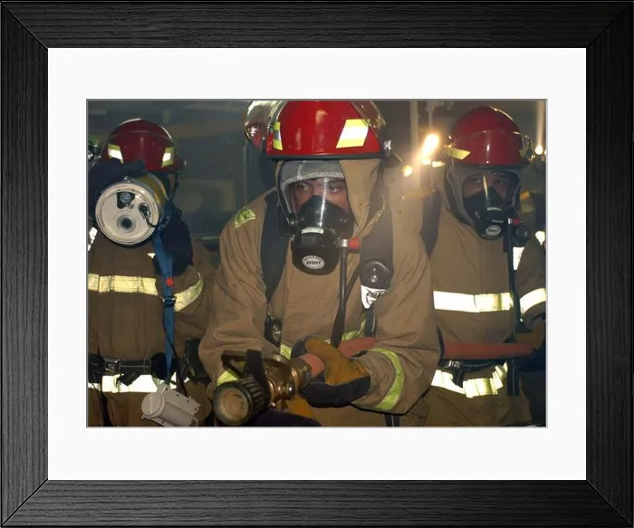 Framed Print : US Navy Machinist's Mate Fireman assigned to hose team one prepares to enter a smoke-filled compartment to combat a Framed Print : US Navy Machinist's Mate Fireman assigned to hose team one prepares to enter a smoke-filled compartment to combat a