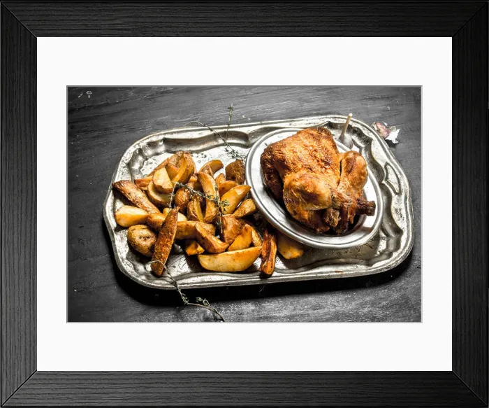 Framed Print : Fried chicken with potatoes on a tray. On the black chalkboard Framed Print : Fried chicken with potatoes on a tray. On the black chalkboard