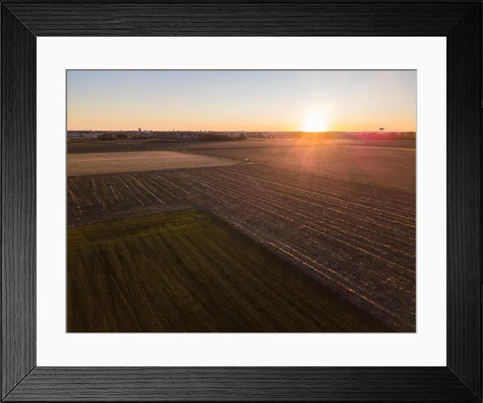 Framed Print : A car crossing a country road, off-road aerial view of a car traveling a dirt road through the fields Framed Print : A car crossing a country road, off-road aerial view of a car traveling a dirt road through the fields