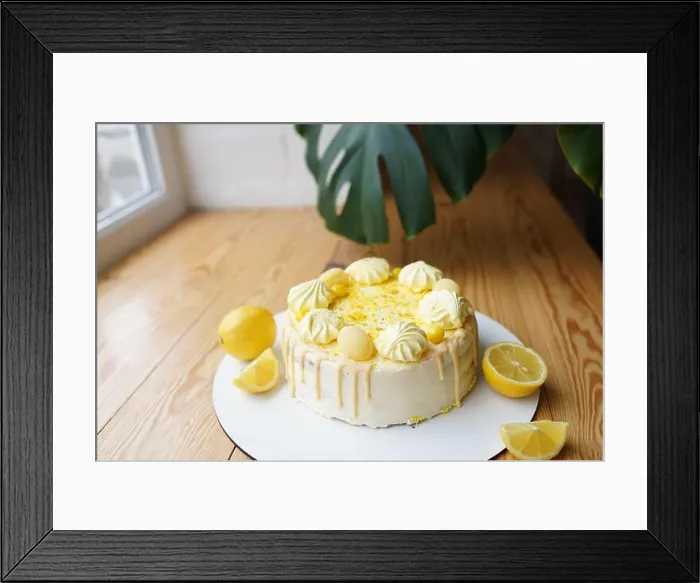 Framed Print : Tender lemon cake with candid lemon and meringue on wooden table Framed Print : Tender lemon cake with candid lemon and meringue on wooden table