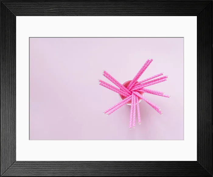 Framed Print : High angle view of paper cup with rose drinking straws polka design on pastel pink background minimal creative concept Framed Print : High angle view of paper cup with rose drinking straws polka design on pastel pink background minimal creative concept