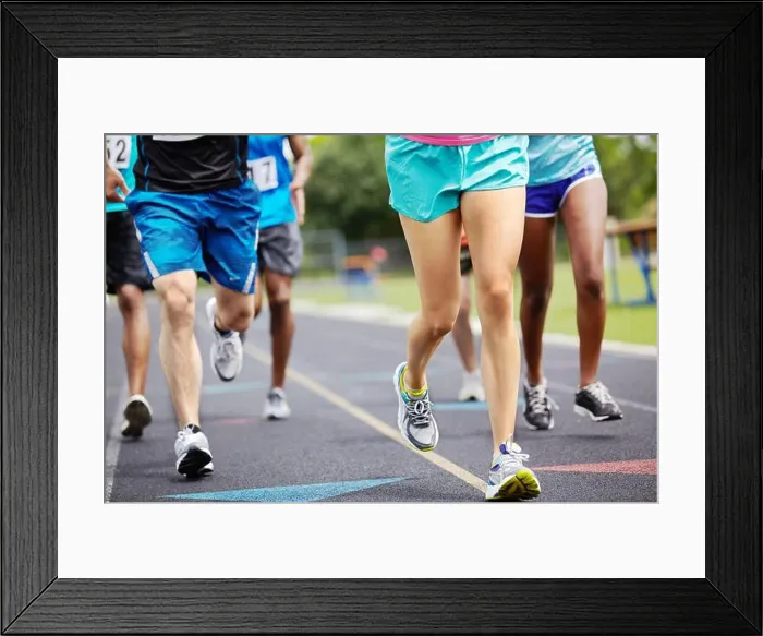 Framed Print : Running for the winning title. Cropped close up shot of athletes legs during a race