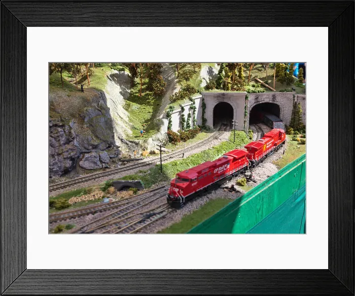 Framed Print : Electric Model Train on miniature train track going through mountain tunnel Framed Print : Electric Model Train on miniature train track going through mountain tunnel