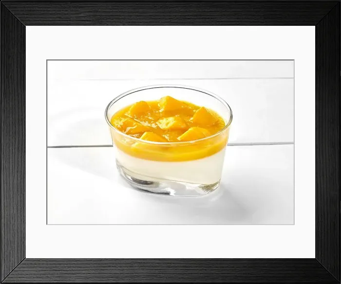 Framed Print : Vanilla panna cotta with mango puree and fresh fruits in glass