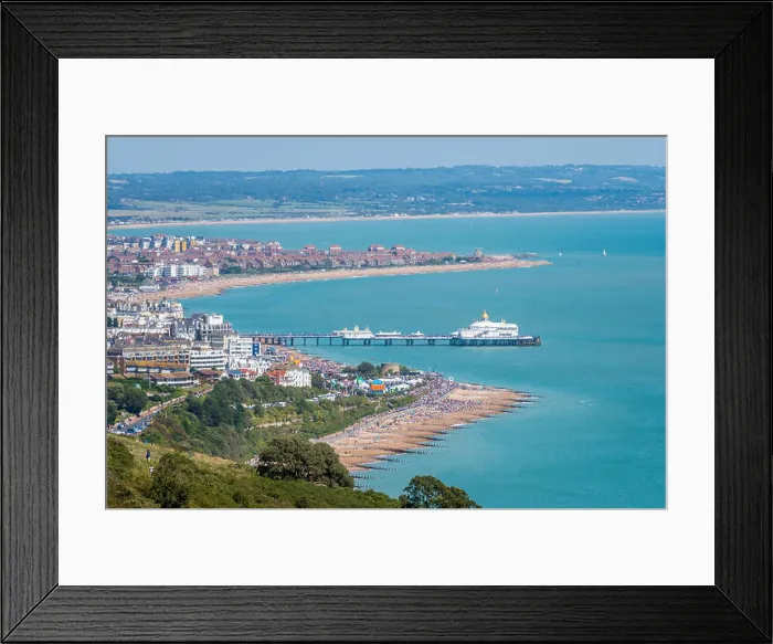 Framed Print : Aerial view of Eastbourne seafront, promenade, pier and English Channel from Beachy Head cliff top footpath Framed Print : Aerial view of Eastbourne seafront, promenade, pier and English Channel from Beachy Head cliff top footpath