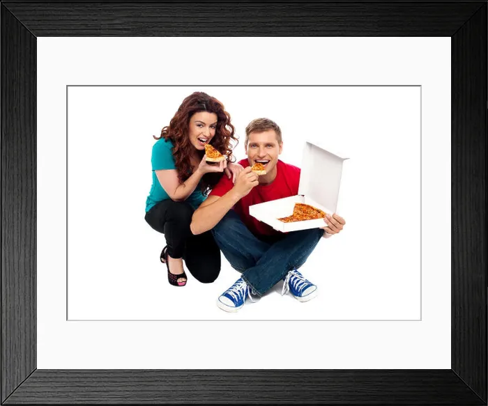 Framed Print : Young couple sitting on floor and enjoying yummy pizza Framed Print : Young couple sitting on floor and enjoying yummy pizza