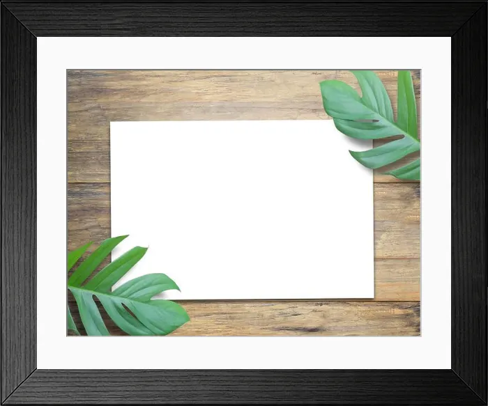 Framed Print : Office desk, Blank paper and leaves on brown wood table background Framed Print : Office desk, Blank paper and leaves on brown wood table background