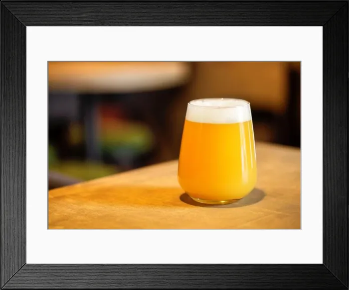 Framed Print : Hazy NEIPA New England IPA pale ale beer, on wood surface, rich frothy foam head with copy space Framed Print : Hazy NEIPA New England IPA pale ale beer, on wood surface, rich frothy foam head with copy space