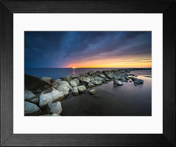 Framed Print : Breakwater of large rocks in the Ijsselmeer near the town of Urk in the province of Flevoland during a dramatic sunset Framed Print : Breakwater of large rocks in the Ijsselmeer near the town of Urk in the province of Flevoland during a dramatic sunset