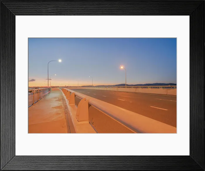 Framed Print : Tauranga Harbour Bridge transport route with road and pedestrian and cycle path with glow of cyclists Framed Print : Tauranga Harbour Bridge transport route with road and pedestrian and cycle path with glow of cyclists