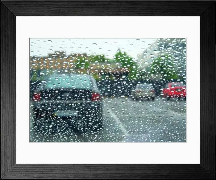 Framed Print : Rainy days. Driving in rain, rainy weather. Rain drops on window Framed Print : Rainy days. Driving in rain, rainy weather. Rain drops on window