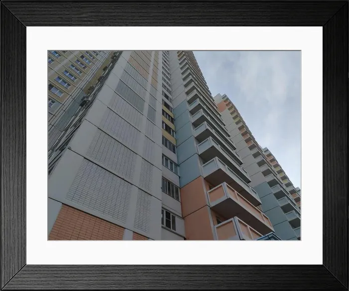Framed Print : A large multi-story residential building with a pastel color palette of pink Framed Print : A large multi-story residential building with a pastel color palette of pink