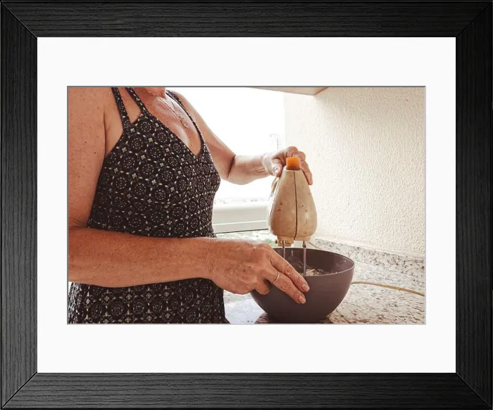 Framed Print : Woman using electric mixer for preparing cheesecake ingredients. Family gastronomy Framed Print : Woman using electric mixer for preparing cheesecake ingredients. Family gastronomy