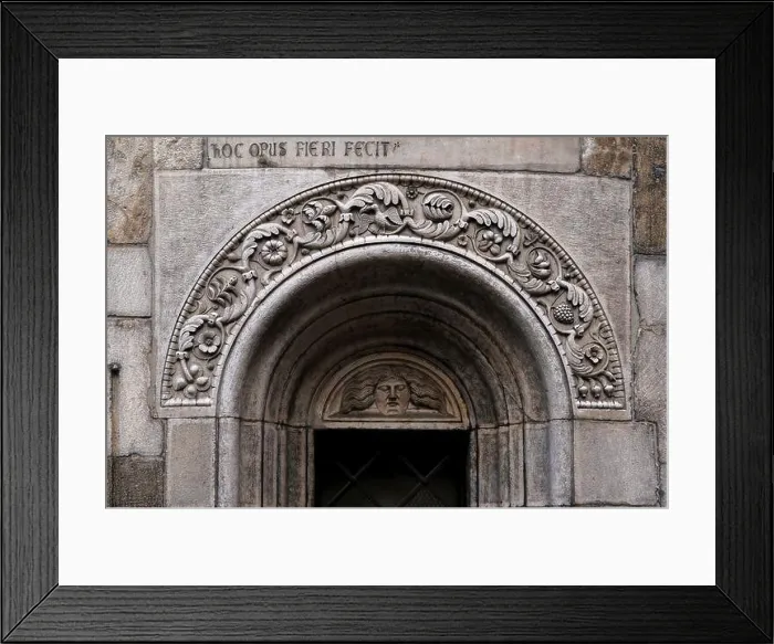 Framed Print : Medusa face with long hair stares from lunette over central apse window of Romanesque cathedral in Piazza Grande Framed Print : Medusa face with long hair stares from lunette over central apse window of Romanesque cathedral in Piazza Grande