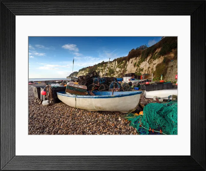 Framed Print : A fishing boat with nets and lobster pots on the beach at Beer on the Jurassic Coast in Devon Framed Print : A fishing boat with nets and lobster pots on the beach at Beer on the Jurassic Coast in Devon
