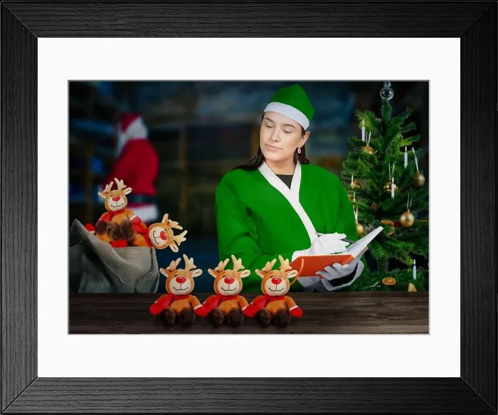 Framed Print : Look into santa claus magical workshop as an elf is checking toys