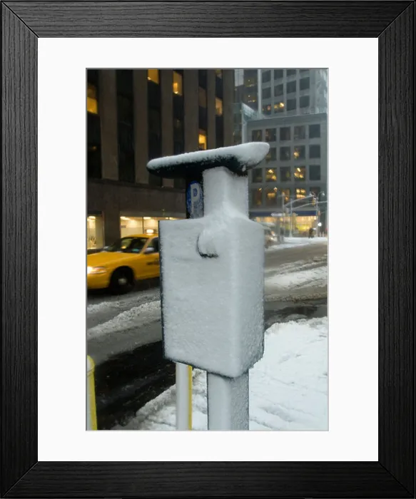 Framed Print : A solar powered muni meter encrusted with ice and snow in midtown Manhattan in New York Framed Print : A solar powered muni meter encrusted with ice and snow in midtown Manhattan in New York