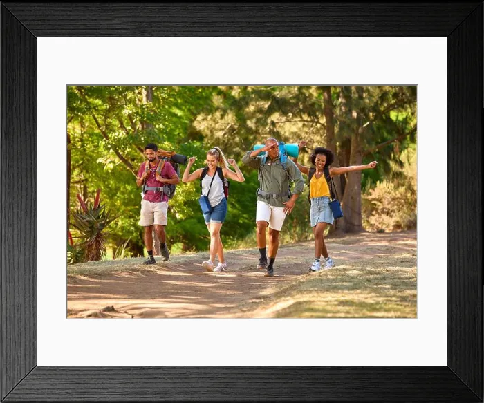 Framed Print : Group Of Friends With Backpacks On Vacation Hiking Through Forest Countryside Together Framed Print : Group Of Friends With Backpacks On Vacation Hiking Through Forest Countryside Together