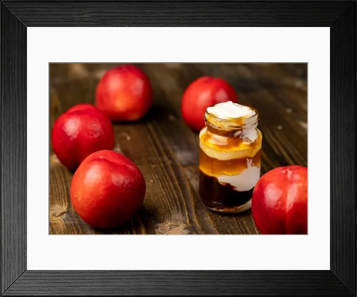 Framed Print : layered yogurt with jam and pieces of ripe nectarine, yogurt in a glass jar with fruits Framed Print : layered yogurt with jam and pieces of ripe nectarine, yogurt in a glass jar with fruits