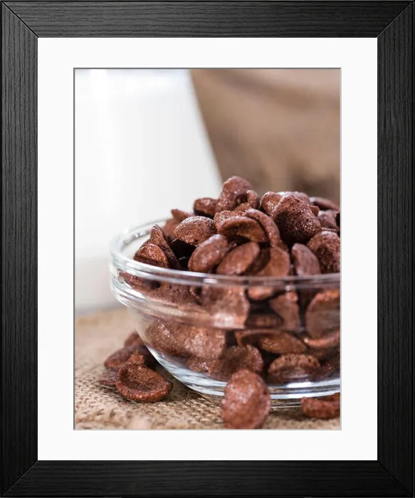 Framed Print : Portion of chocolate cornklakes on wooden background (close-up shot) Framed Print : Portion of chocolate cornklakes on wooden background (close-up shot)