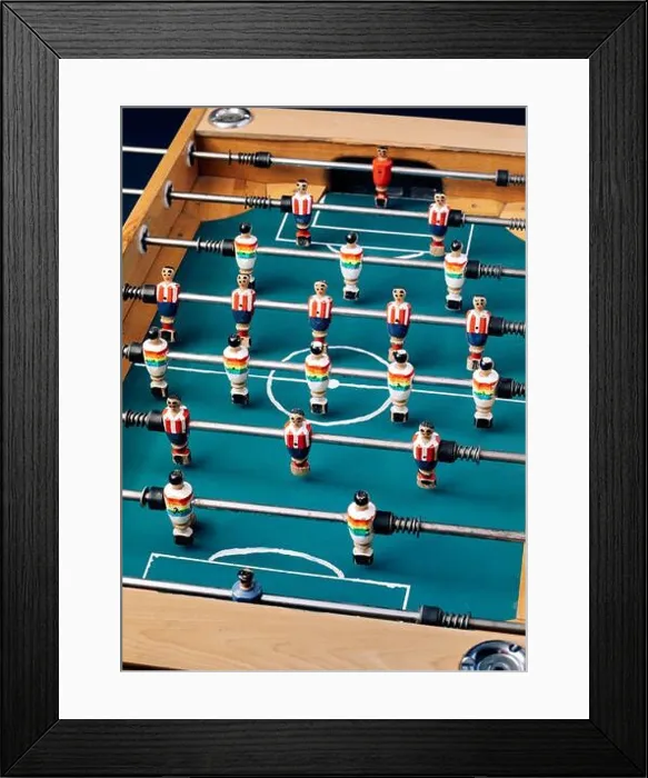 Framed Print : High angle of detail of retro table soccer with wooden miniature figurines of players on metal bars Framed Print : High angle of detail of retro table soccer with wooden miniature figurines of players on metal bars