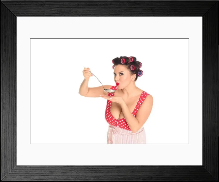 Framed Print : emotional plus size housewife cooking with ladle looking at camera isolated on white