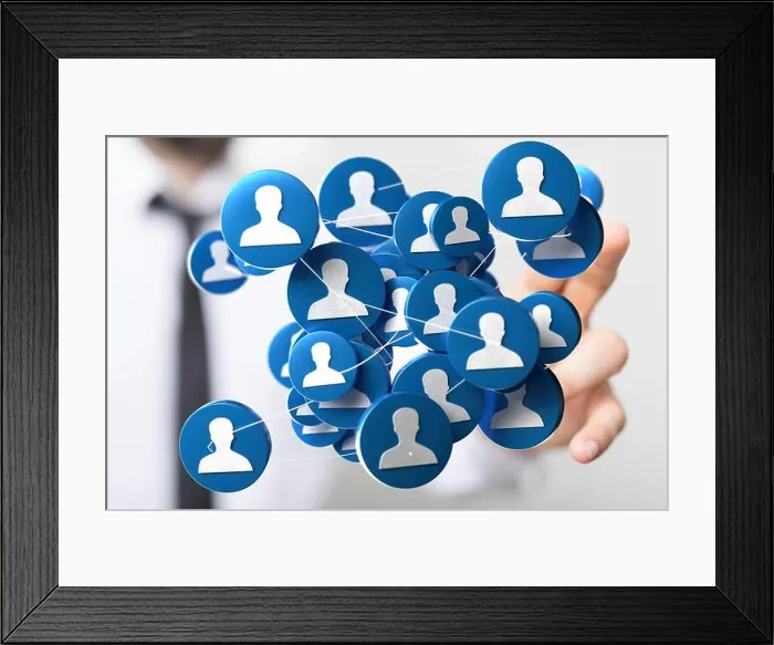 Framed Print : Person's hand touching 3D rendered people silhouettes in the network team Framed Print : Person's hand touching 3D rendered people silhouettes in the network team