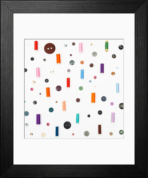Framed Print : many spools of sewing thread and various buttons Framed Print : many spools of sewing thread and various buttons