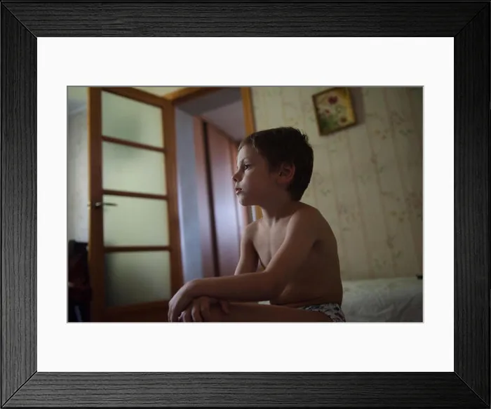 Framed Print : lonely little boy sitting in the room with no clothes on Framed Print : lonely little boy sitting in the room with no clothes on