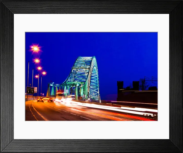 Framed Print : Car traffic light trails crossing The Silver Jubilee Bridge, Runcorn at night, Cheshire, England, UK Framed Print : Car traffic light trails crossing The Silver Jubilee Bridge, Runcorn at night, Cheshire, England, UK