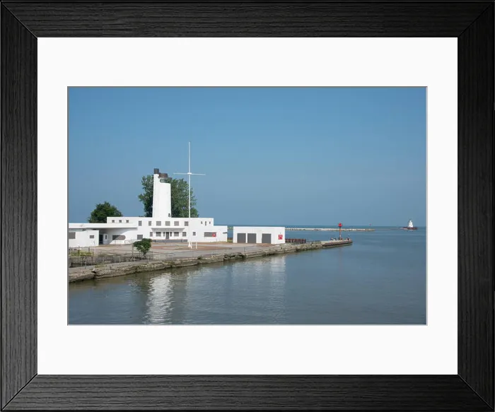 Framed Print : Ohio, Lake Erie, Cleveland. Cleveland Harbor, historic Coast Guard Station and Boat House, people fishing off the pier Framed Print : Ohio, Lake Erie, Cleveland. Cleveland Harbor, historic Coast Guard Station and Boat House, people fishing off the pier
