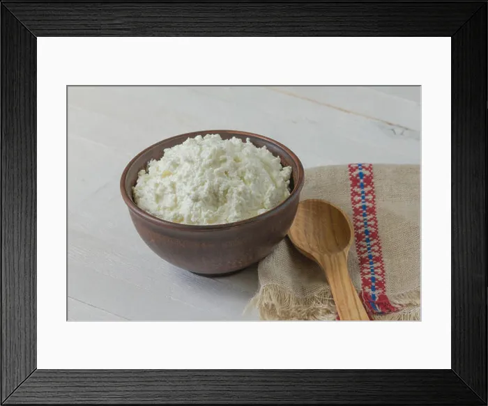 Framed Print : Cottage cheese in a brown ceramic bowl with authentic flax embroidered napkin Framed Print : Cottage cheese in a brown ceramic bowl with authentic flax embroidered napkin