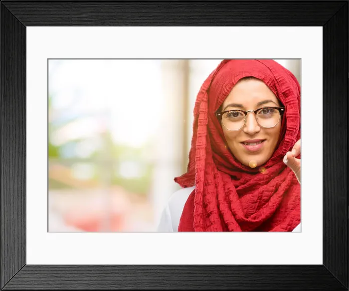 Framed Print : Young arab woman wearing hijab doing ok sign with hand, approve gesture Framed Print : Young arab woman wearing hijab doing ok sign with hand, approve gesture