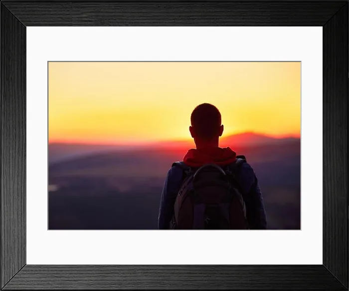 Framed Print : Traveler with backpack watching amazing sunset Framed Print : Traveler with backpack watching amazing sunset