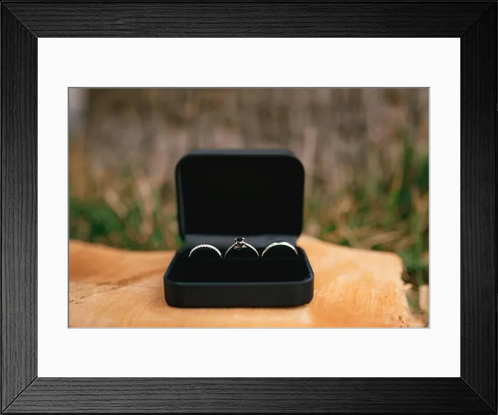 Framed Print : Wedding rings in white gold and an engagement ring in a black velvet box on a wooden base Framed Print : Wedding rings in white gold and an engagement ring in a black velvet box on a wooden base