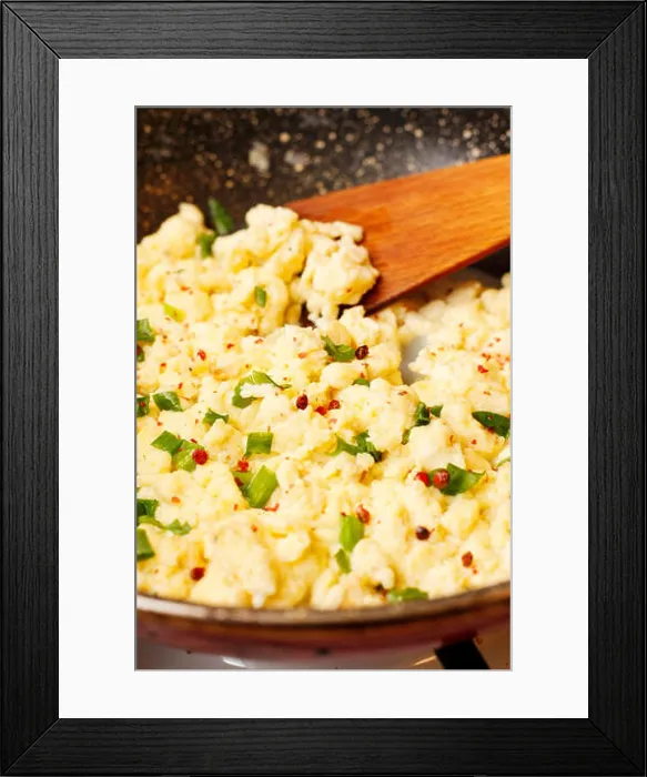 Framed Print : Scrambled eggs with onion on black pan Framed Print : Scrambled eggs with onion on black pan
