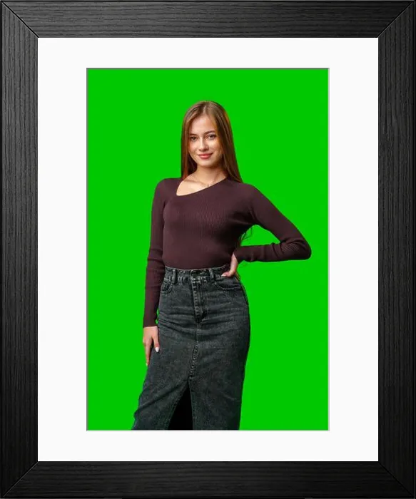 Framed Print : Young Woman Wearing a Brown Sweater and Denim Skirt Against Green Screen Framed Print : Young Woman Wearing a Brown Sweater and Denim Skirt Against Green Screen