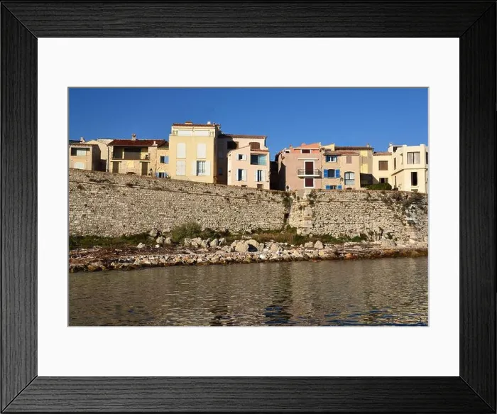 Framed Print : France, french riviera, Antibes, the ramparts of the old town and the typical houses dominating the mediterranean sea Framed Print : France, french riviera, Antibes, the ramparts of the old town and the typical houses dominating the mediterranean sea