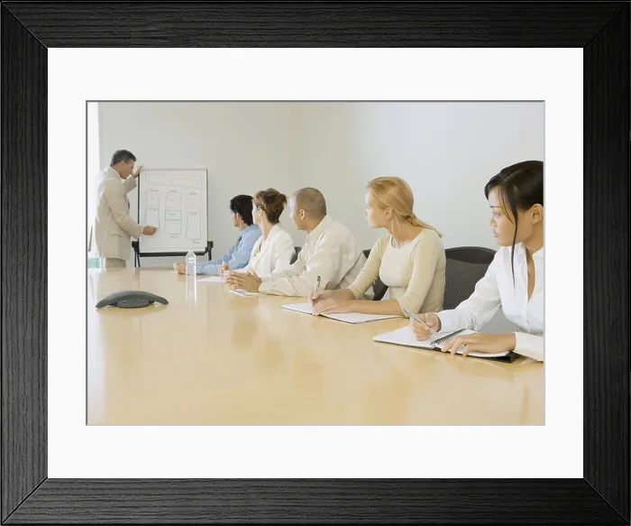 Framed Print : Businessman giving presentation in board room Framed Print : Businessman giving presentation in board room