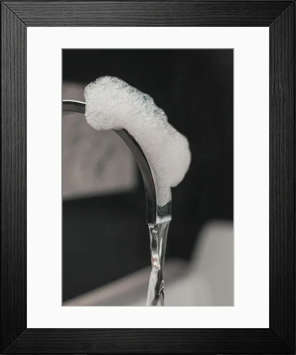 Framed Print : close up shot of bathtub tap covered by foam Framed Print : close up shot of bathtub tap covered by foam
