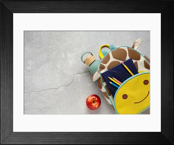 Framed Print : Giraffe backpack with school supplies, a red apple and water bottle on a concrete surface. Back to school concept Framed Print : Giraffe backpack with school supplies, a red apple and water bottle on a concrete surface. Back to school concept