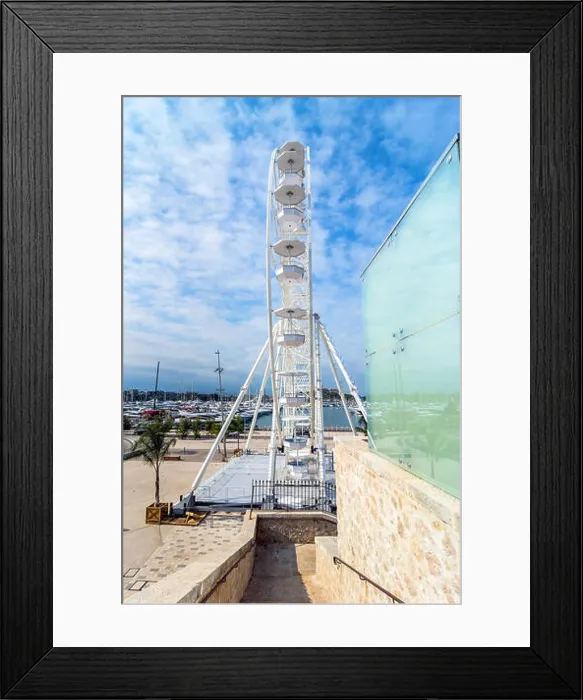 Framed Print : Antibes, France - July 01, 2016: day view of port Vauban and grande roue in Antibes Framed Print : Antibes, France - July 01, 2016: day view of port Vauban and grande roue in Antibes