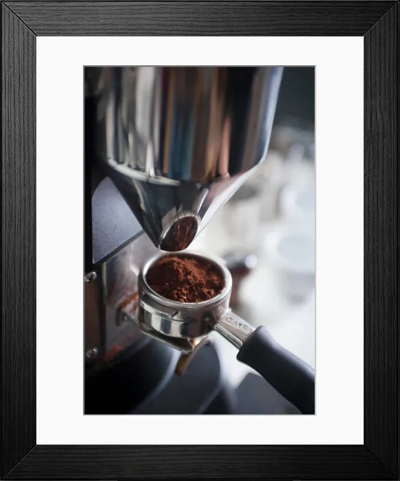 Framed Print : Filling portafilter basket with ground coffee Framed Print : Filling portafilter basket with ground coffee
