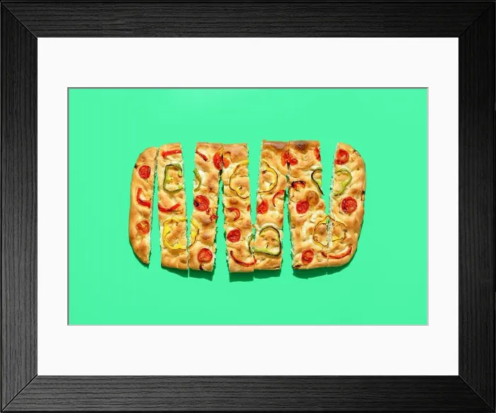 Framed Print : Table top view with vegan focaccia sliced in pieces Framed Print : Table top view with vegan focaccia sliced in pieces