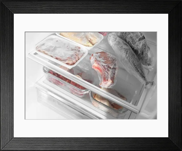 Framed Print : Different frozen meat and fish products in fridge, closeup Framed Print : Different frozen meat and fish products in fridge, closeup