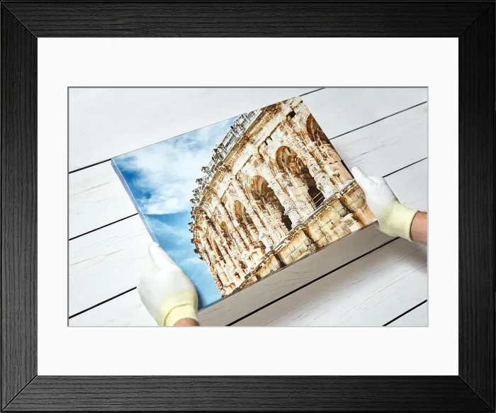 Framed Print : Photography printed on canvas with gallery wrap method of canvas stretching in male hands Framed Print : Photography printed on canvas with gallery wrap method of canvas stretching in male hands