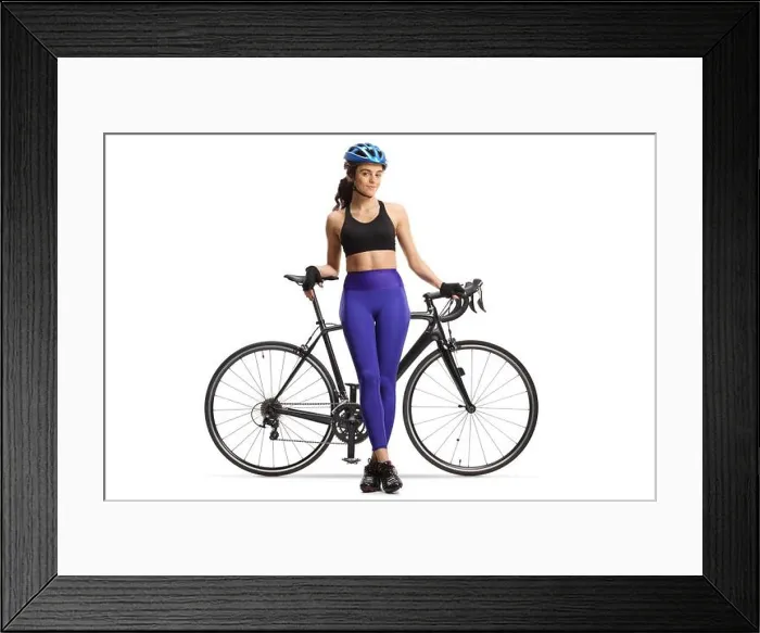 Framed Print : Female cyclist sitting on a road bicycle and posing isolated on white background Framed Print : Female cyclist sitting on a road bicycle and posing isolated on white background