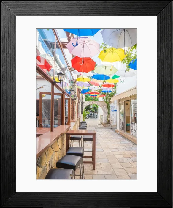 Framed Print : Colorful umbrellas hanging down at narrow streets of Bodrum with white houses in Greek style Bodrum Framed Print : Colorful umbrellas hanging down at narrow streets of Bodrum with white houses in Greek style Bodrum
